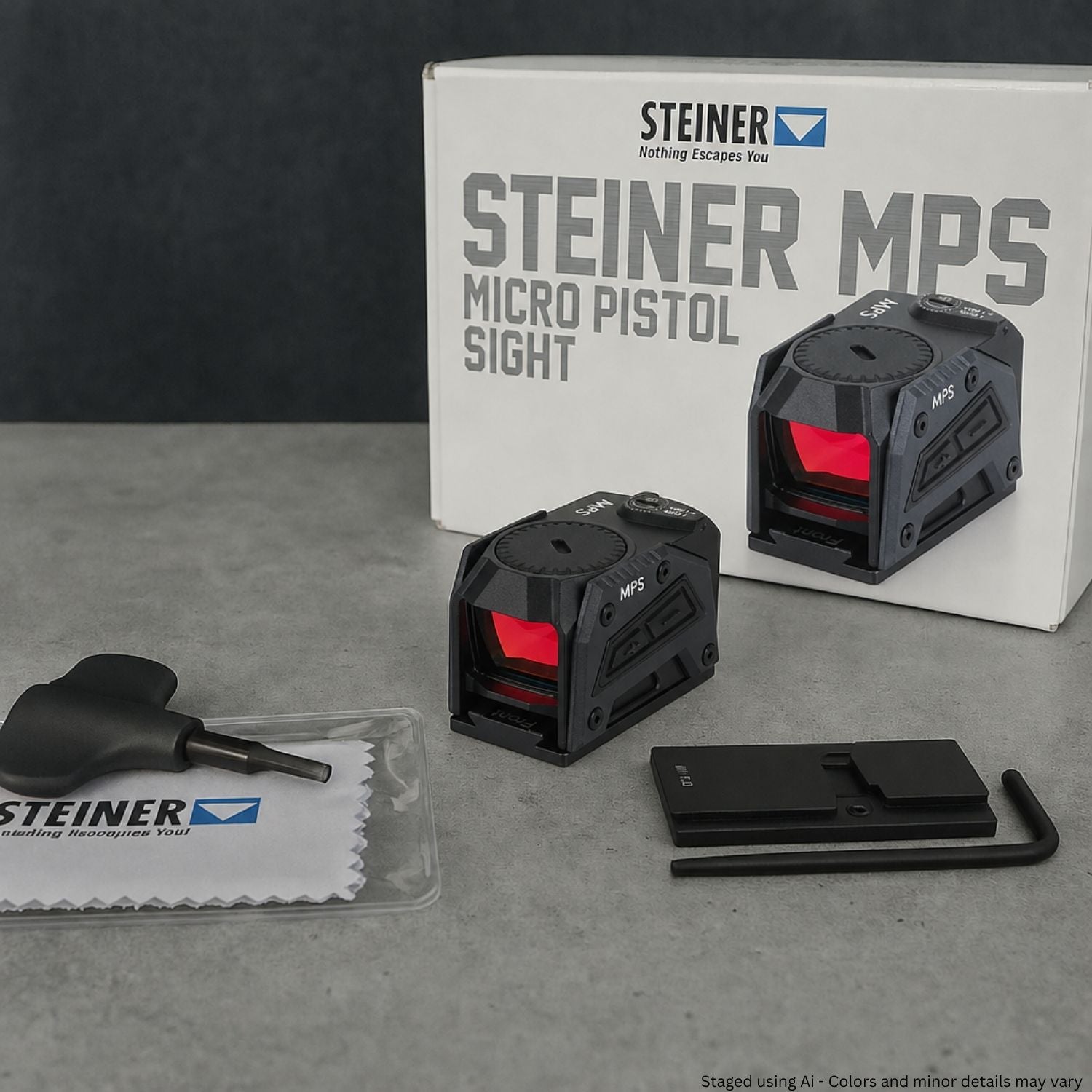 Steiner MPS Micro Pistol Sight with packaging and cleaning cloth on a gray surface