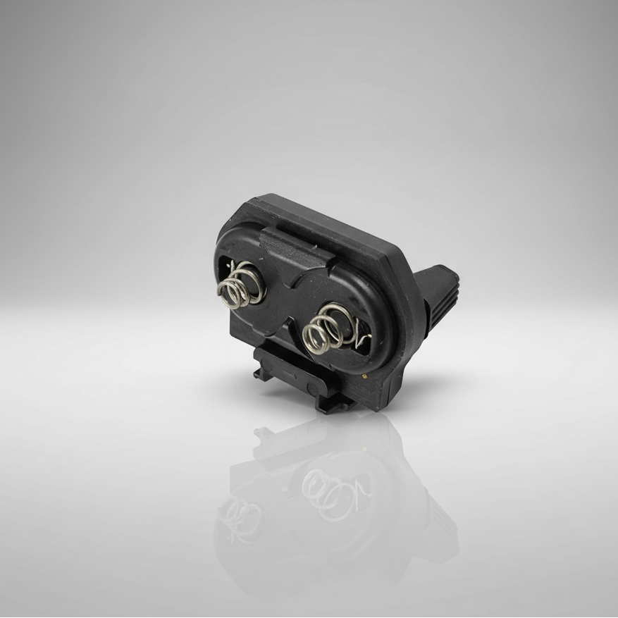 Black electronic component on a reflective gray surface with a gradient background