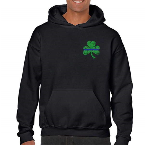 Man wearing a black Thin Blue Line hoodie featuring a green shamrock design for St. Patrick's Day celebrations.