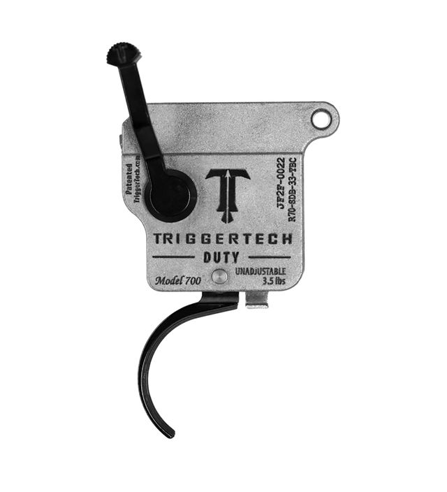 TriggerTech Rem700 Duty trigger with a black curved design and bolt release, featuring efficient die-cast housing.