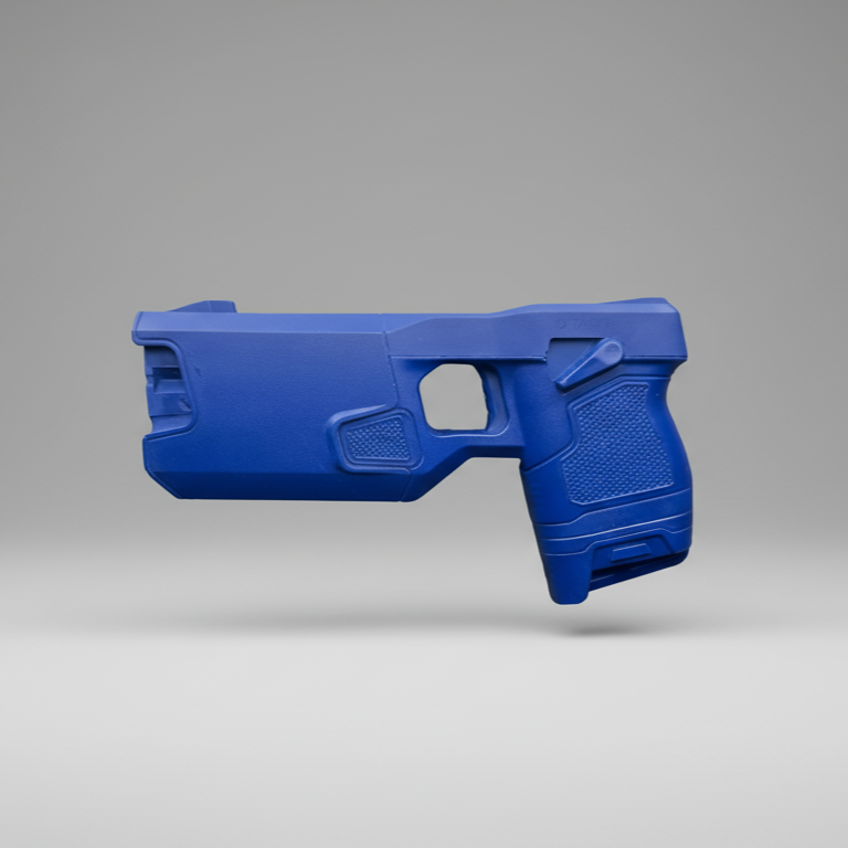 Blue Taser 7 training weapon on a gray background