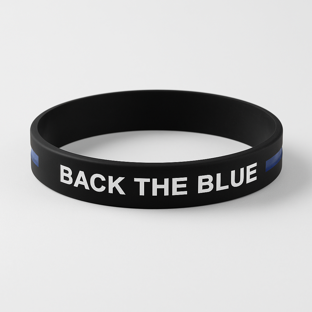 Black wristband with 'BACK THE BLUE' text on a white background