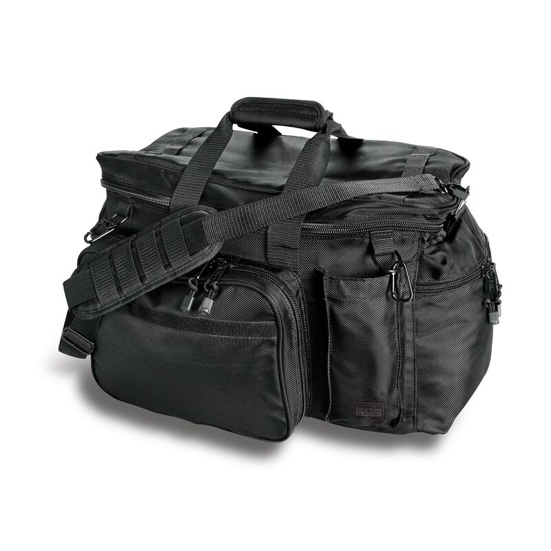 Black tactical bag with multiple compartments and straps on a white background