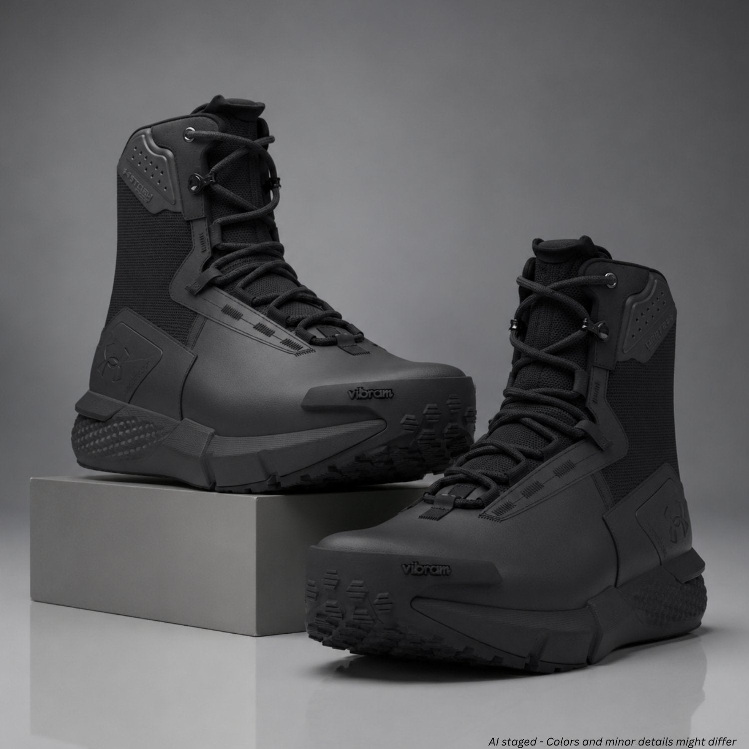 Black tactical boots on a gray background