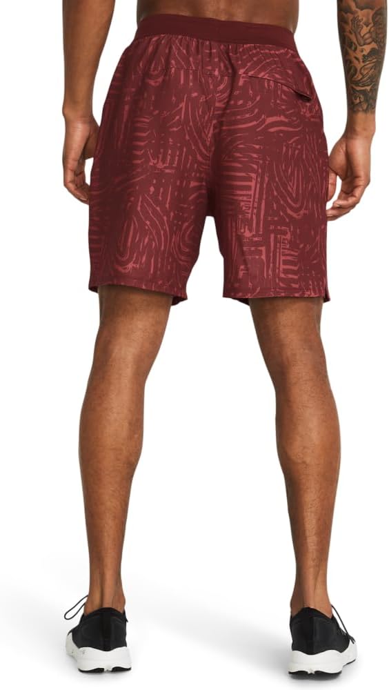 Maroon patterned shorts worn by a person on a white background