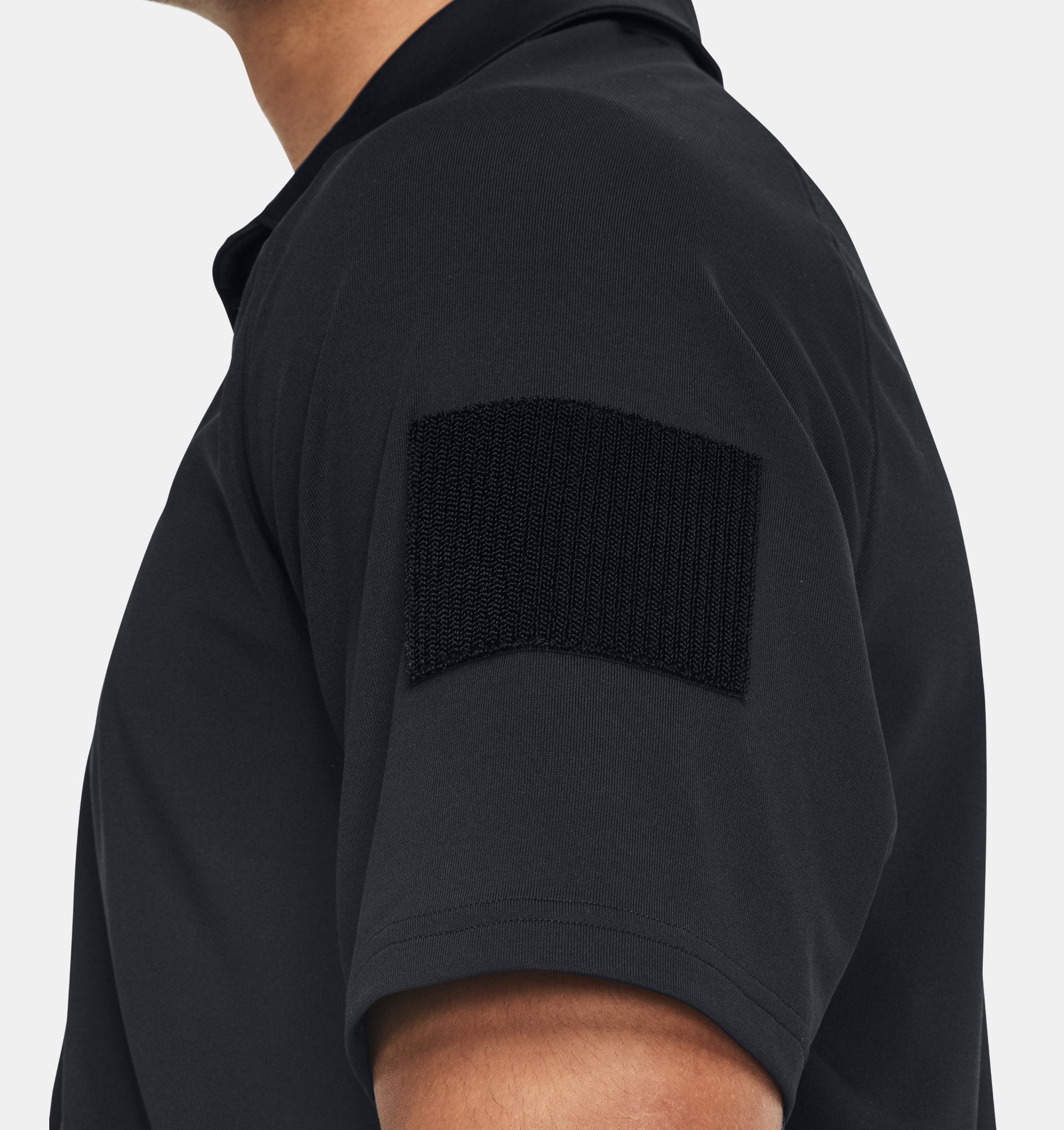 Under Armour Men's UA Tac Elite Polo featuring tactical sleeve patch for uniform customization and enhanced functionality.