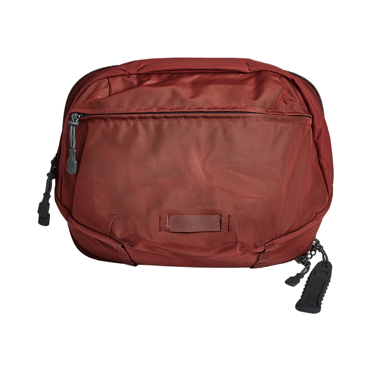 Vertx Pro Navigator bag in red, versatile design with zippered front pocket and durable fabric for outdoor adventures.