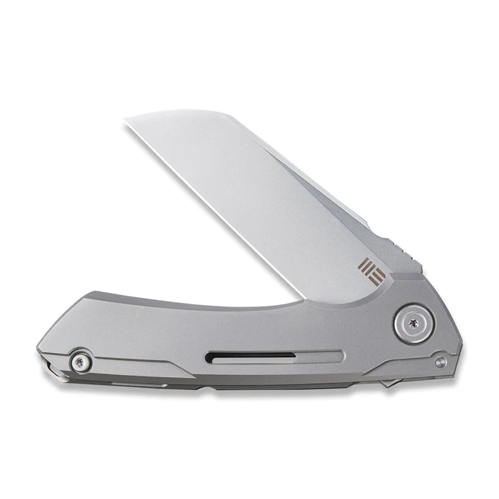 We Knife Mini Buster Flipper Knife showcasing sleek stainless steel design and blade opened for precision use.