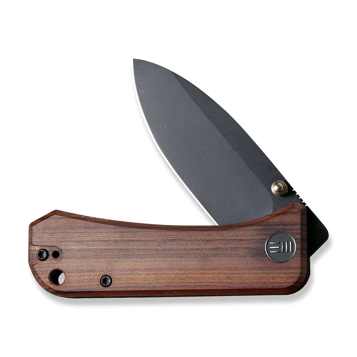 We Knife Banter Thumb Stud Knife with wood handle and CPM S35VN blade, compact design for everyday carry.