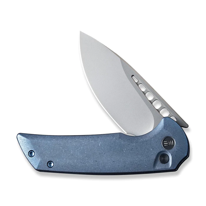We Knife Mini Malice Flipper with button lock, featuring a sleek gray handle and a sharp stainless steel blade.