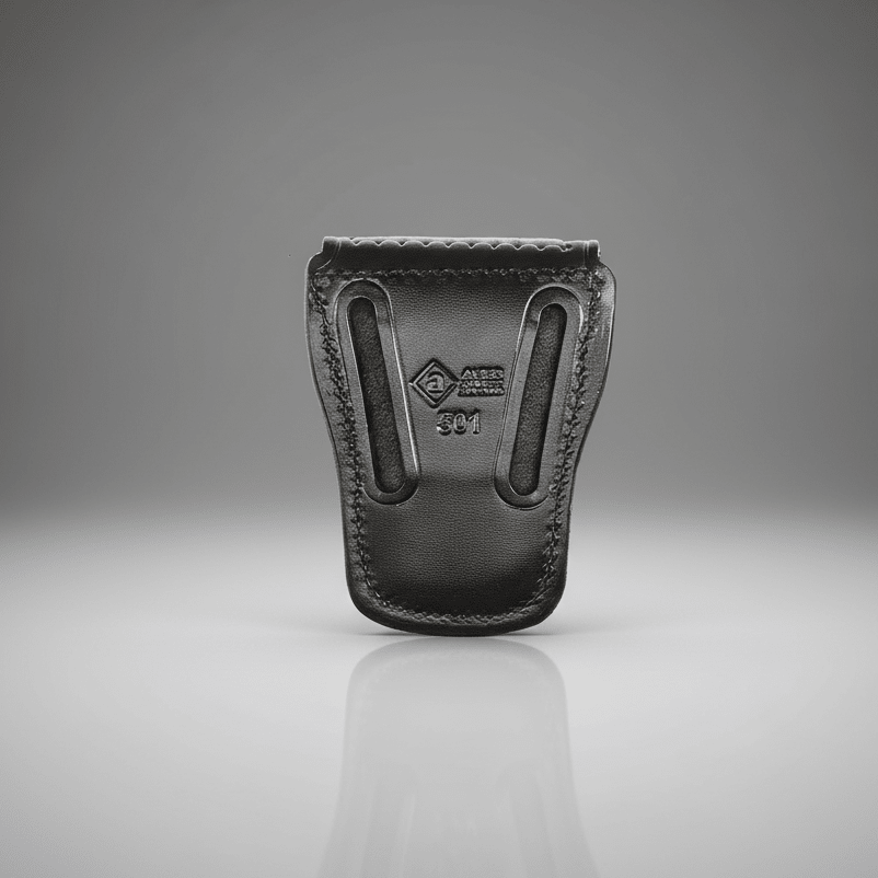 Black leather holster on a reflective surface with a gray background