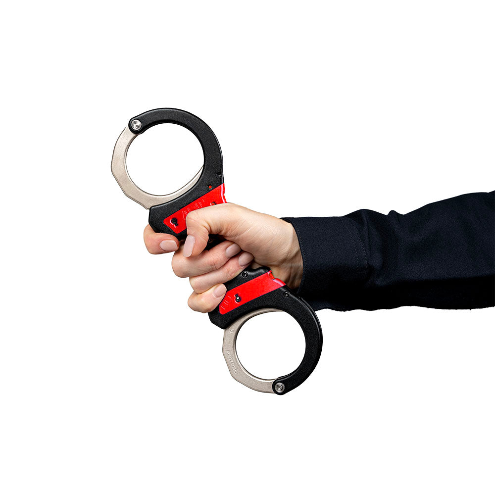 ASP 07440 red training chain cuffs held in hand, showing red lockset indicator bar
