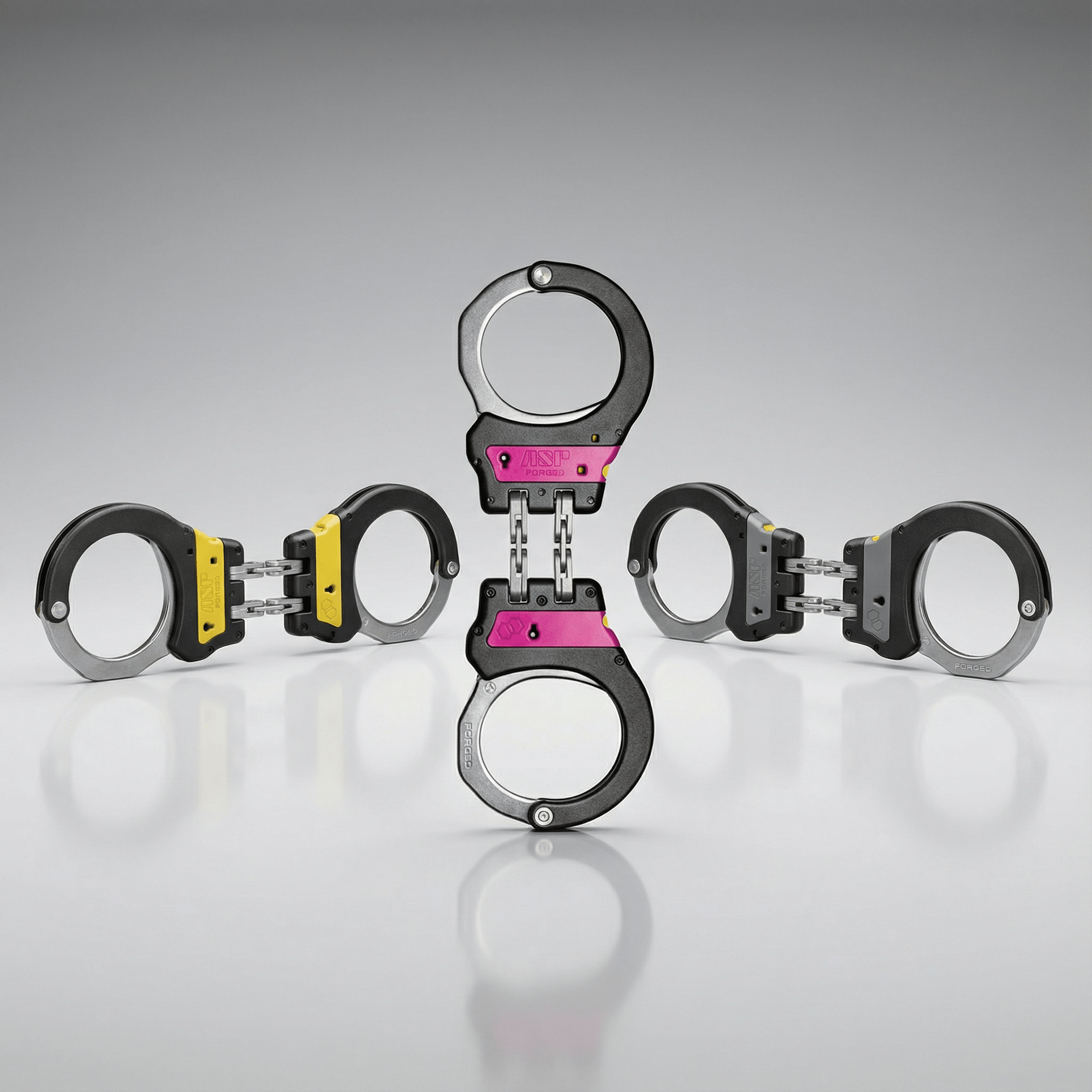 ASP Identifier Hinge Ultra Plus Cuffs hinged handcuffs with pink, yellow, or gray Identifier panels 5607 Series on a reflective surface