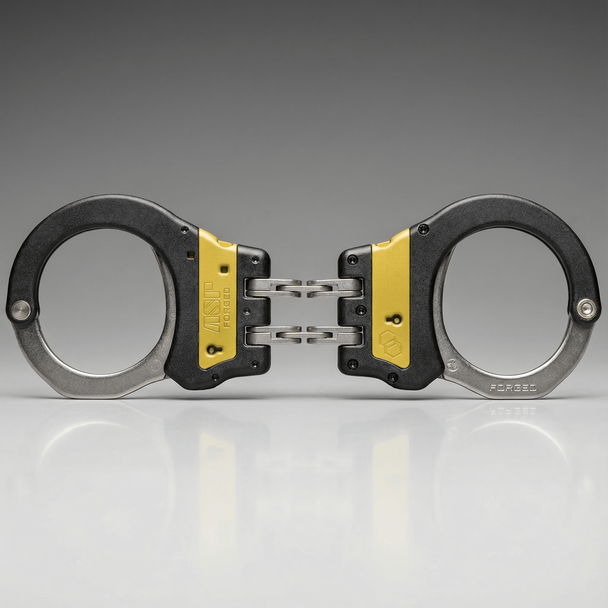 Pair of handcuffs with yellow accents on a gray background