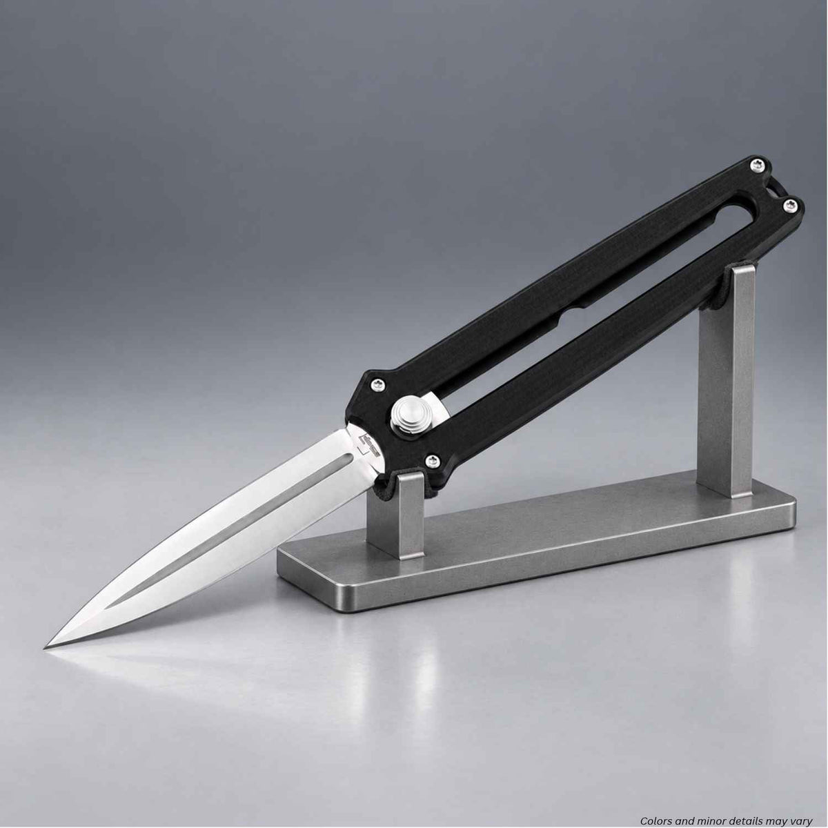Böker Plus Slike manual OTF dagger extended and shown on a metal display stand
