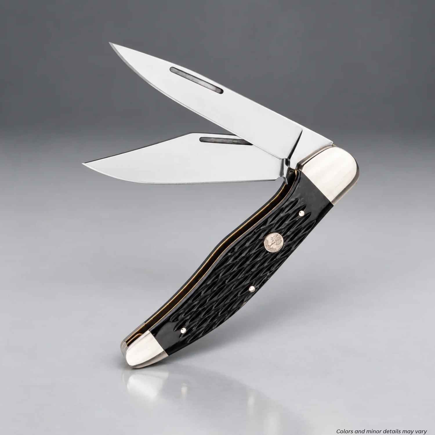Two-blade Boker Treebrand Folding Hunter slipjoint knife standing with both blades open and black jigged bone scales
