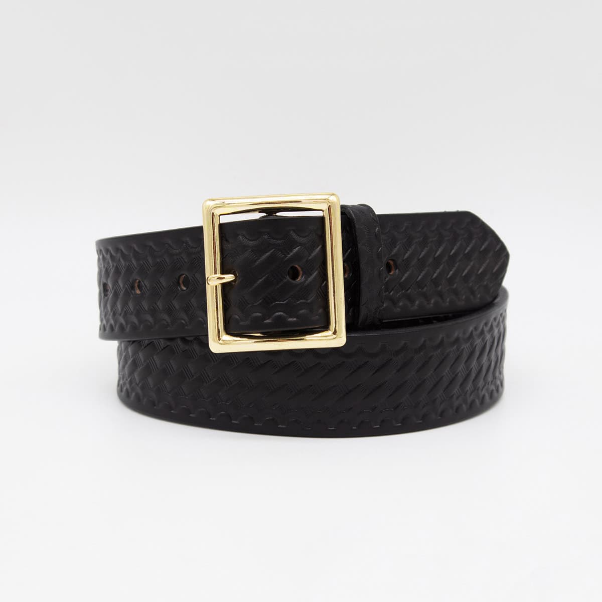 A black woven leather belt with a textured pattern and a polished gold-tone rectangular buckle, coiled on a light gray background.