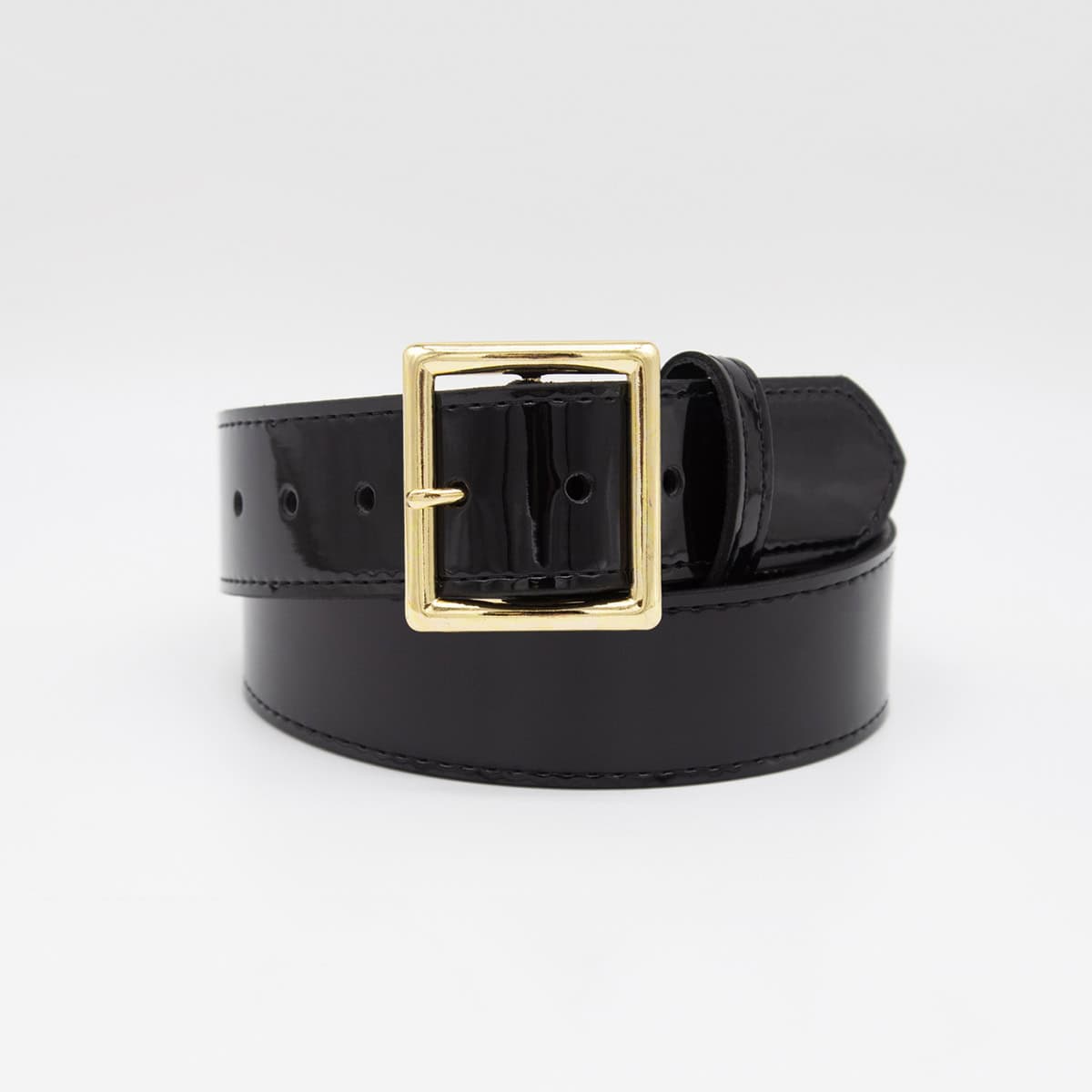 A black patent leather belt with a square gold buckle, coiled on a light gray background.