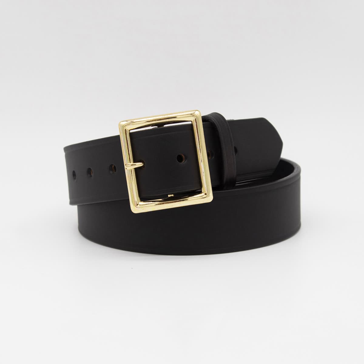 Black belt with a gold buckle on a white background