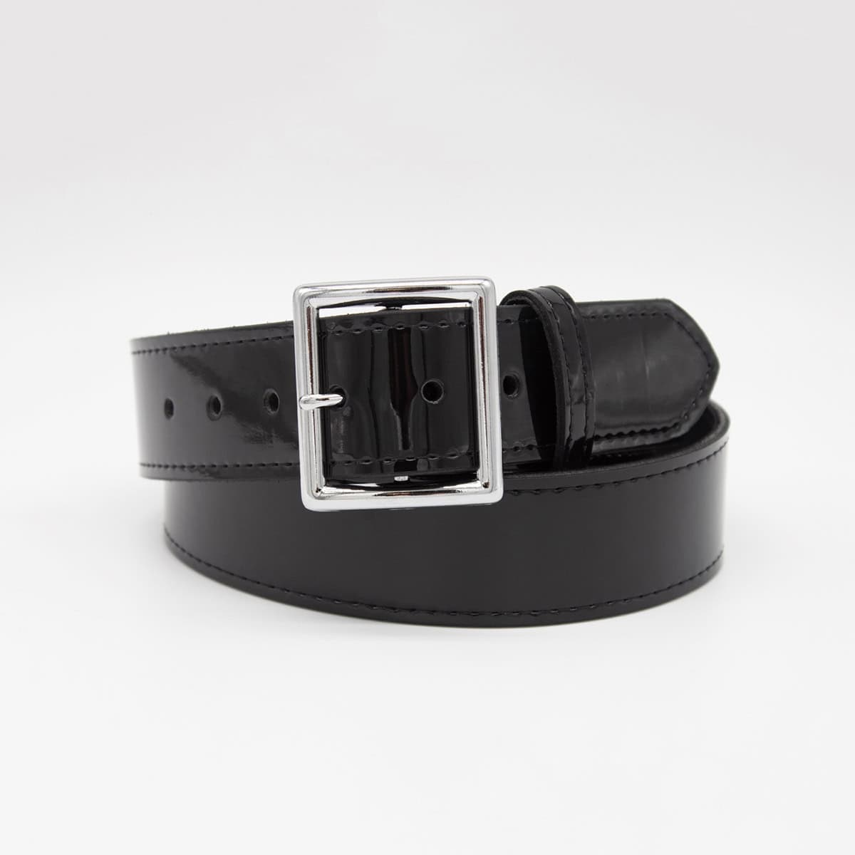 A black leather belt with a polished silver-tone rectangular buckle, neatly coiled on a light gray background.
