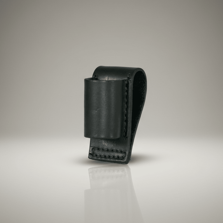 Black leather loop style flashlight holder on a reflective surface with a gradient background