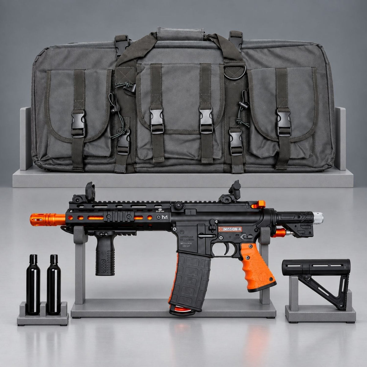 Byrna Mission-4 launcher kit with gray carrying bag, two CO2 cylinders and detached stock on gray display racks.