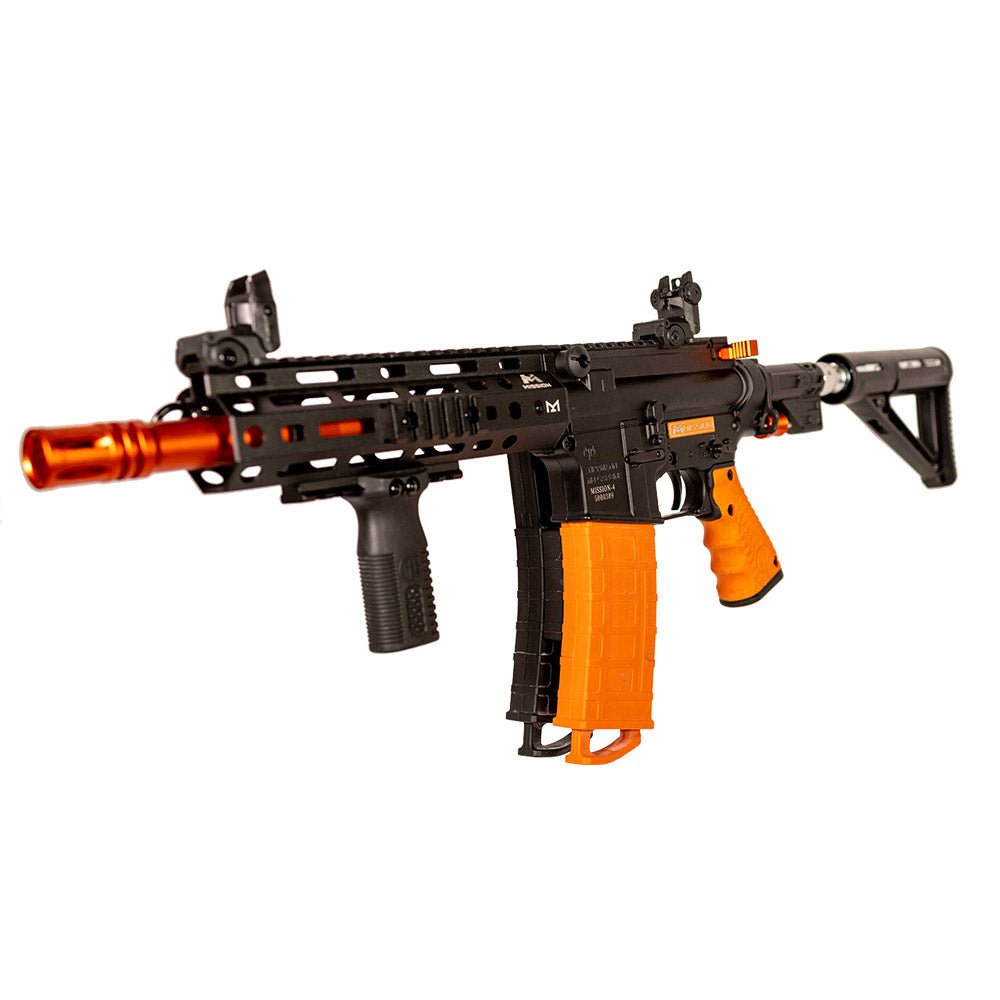 Front angled view of the black and orange Byrna Mission-4 launcher with paired magazines, foregrip and stock.