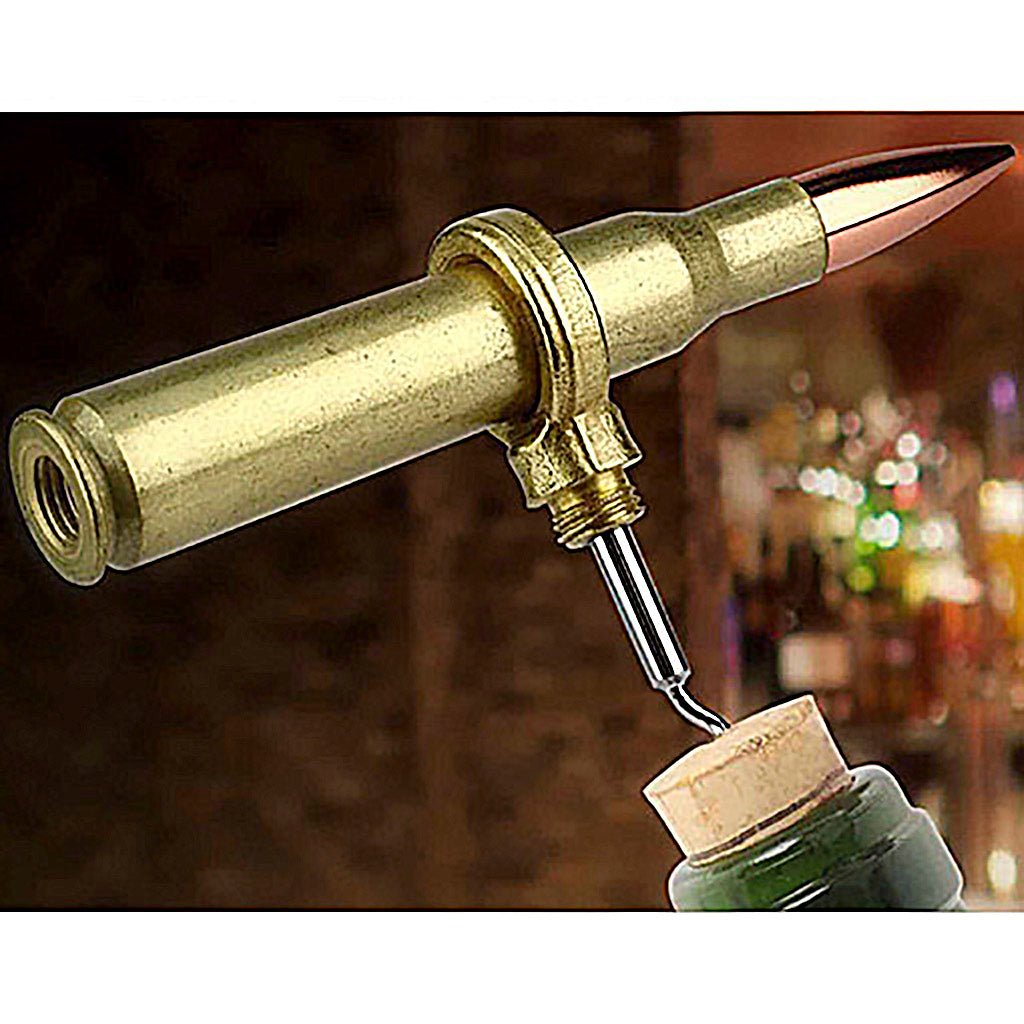 Bottle opener designed like a bullet with brass casing, being used on a bottle.