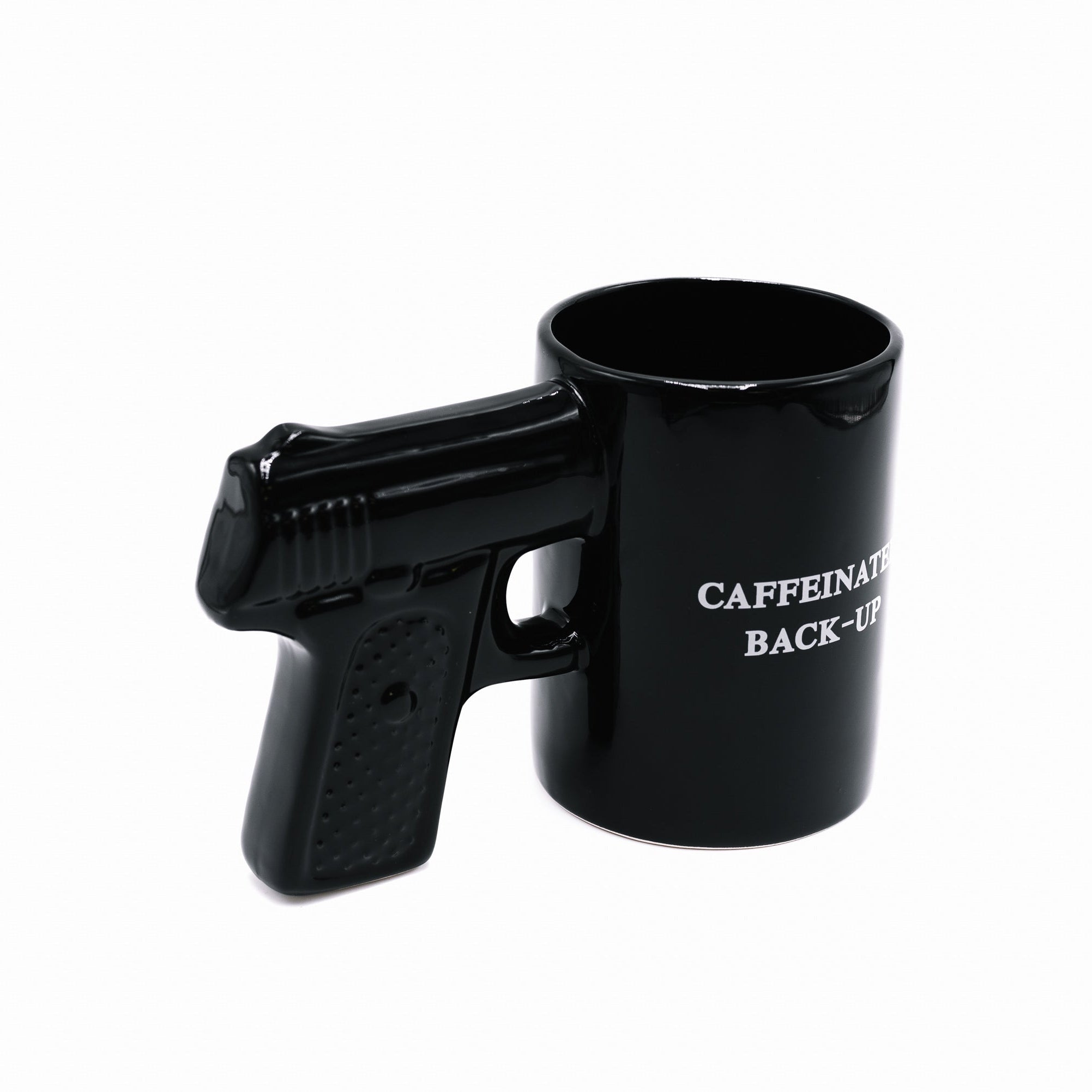Black gun-shaped mug with 'CAFFEINATED BACK-UP' text on a white background