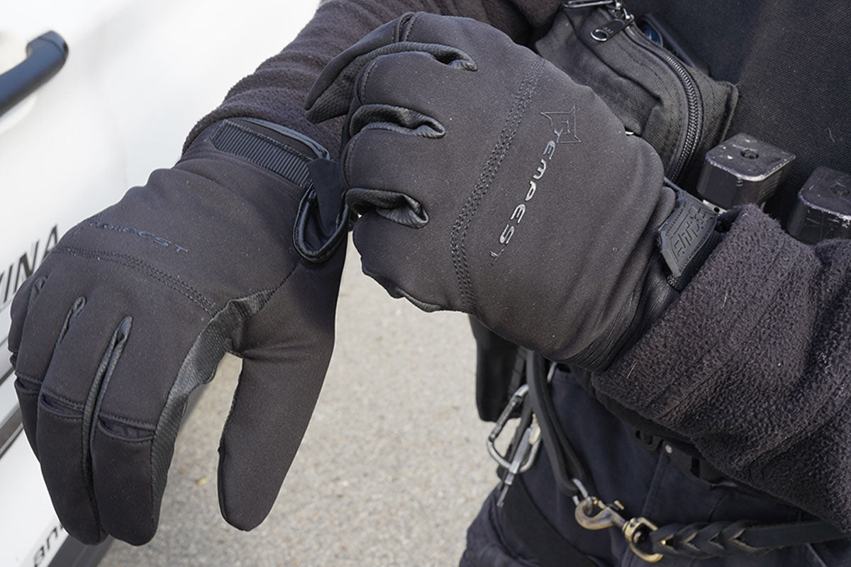 Damascus Tempest DZ18 black gloves worn on both hands, back view showing Tempest logo
