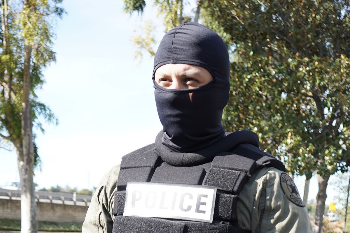 Police officer wearing Damascus Nomex Heavyweight Hood NH100H black flame-resistant tactical balaclava, front view