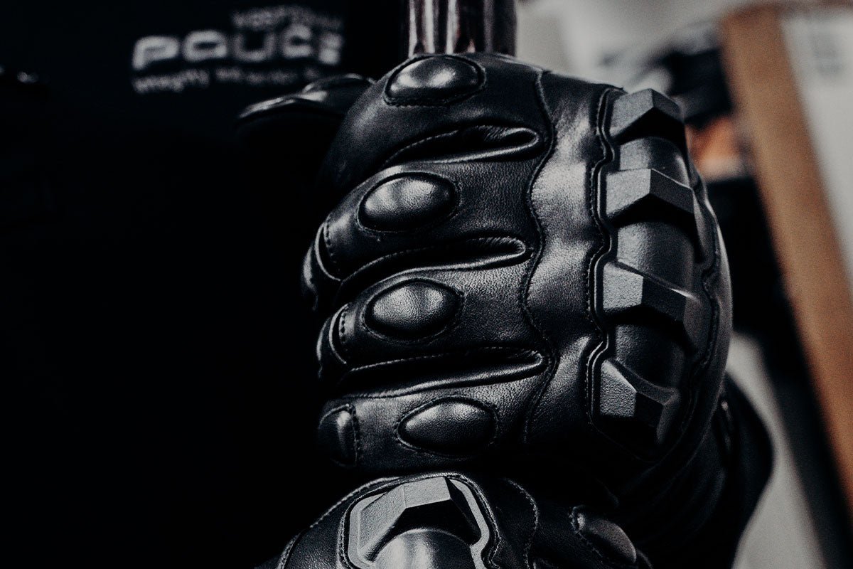 Close-up of Damascus Phenom 6 PG1 hard knuckle riot gloves showing thermoplastic knuckle armor