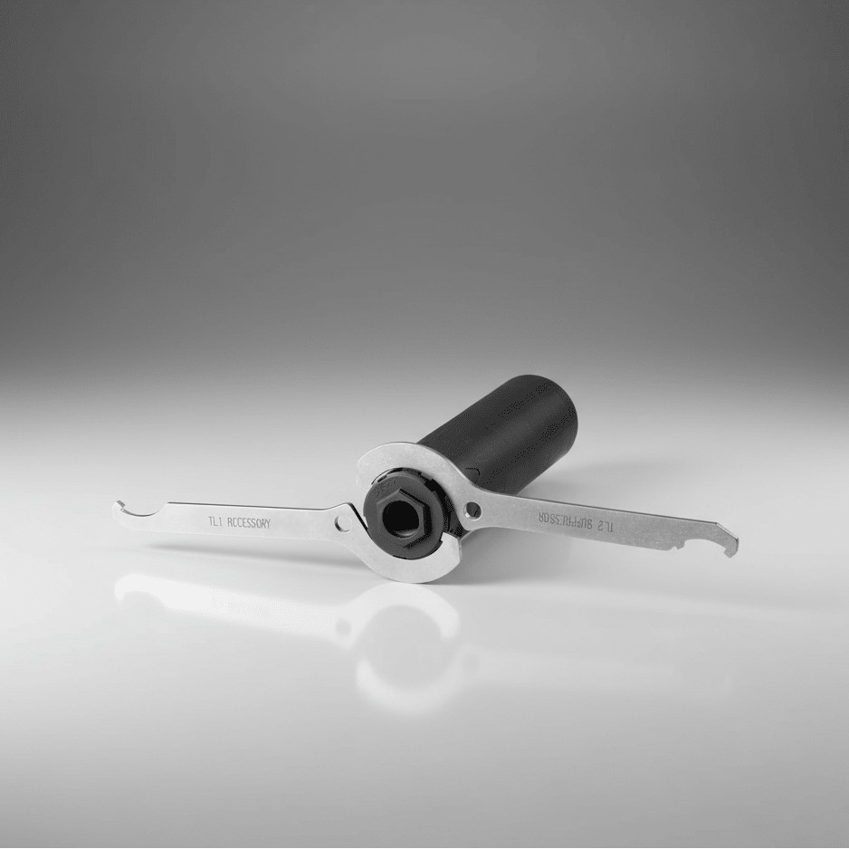 Dead Air Armament Enhanced Spanner Wrench Kit for Both R-Series and P-Series Mounting Adapters in use on a gray background