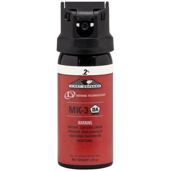 Red pepper spray canister with black top on a white background 