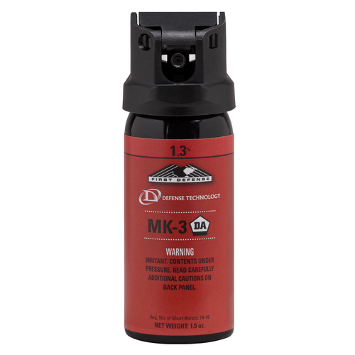 Red pepper spray canister with black top on a white background