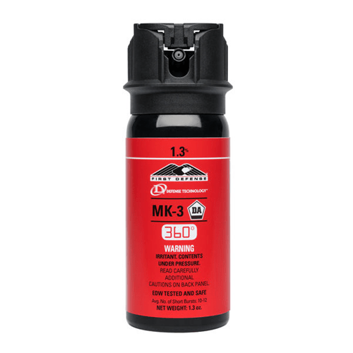 Red pepper spray canister with black cap on a white background