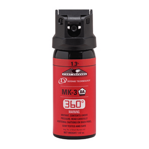 Red and black pepper spray bottle with visible branding on a white background