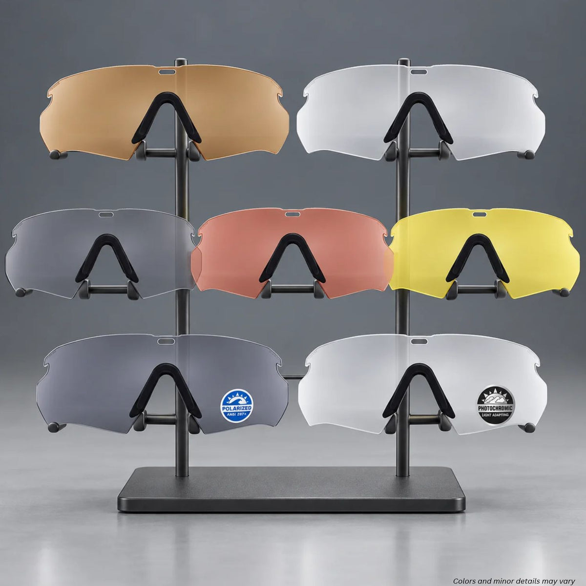 ESS Crossbow Replacement Lens lineup in seven colors, each with a black Low-Pro nosepiece, on a display stand
