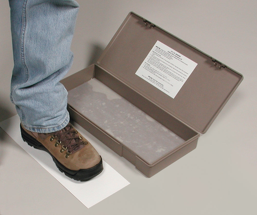 Sirchie EZID400 footwear impression system shown in use with subject stepping through the stain-free inkless pad before stepping onto a pre-sensitized impression card