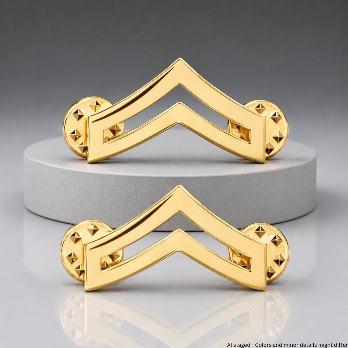 Corporal Chevron Rank Collar Pins - Gold-plated pair displayed on pedestal