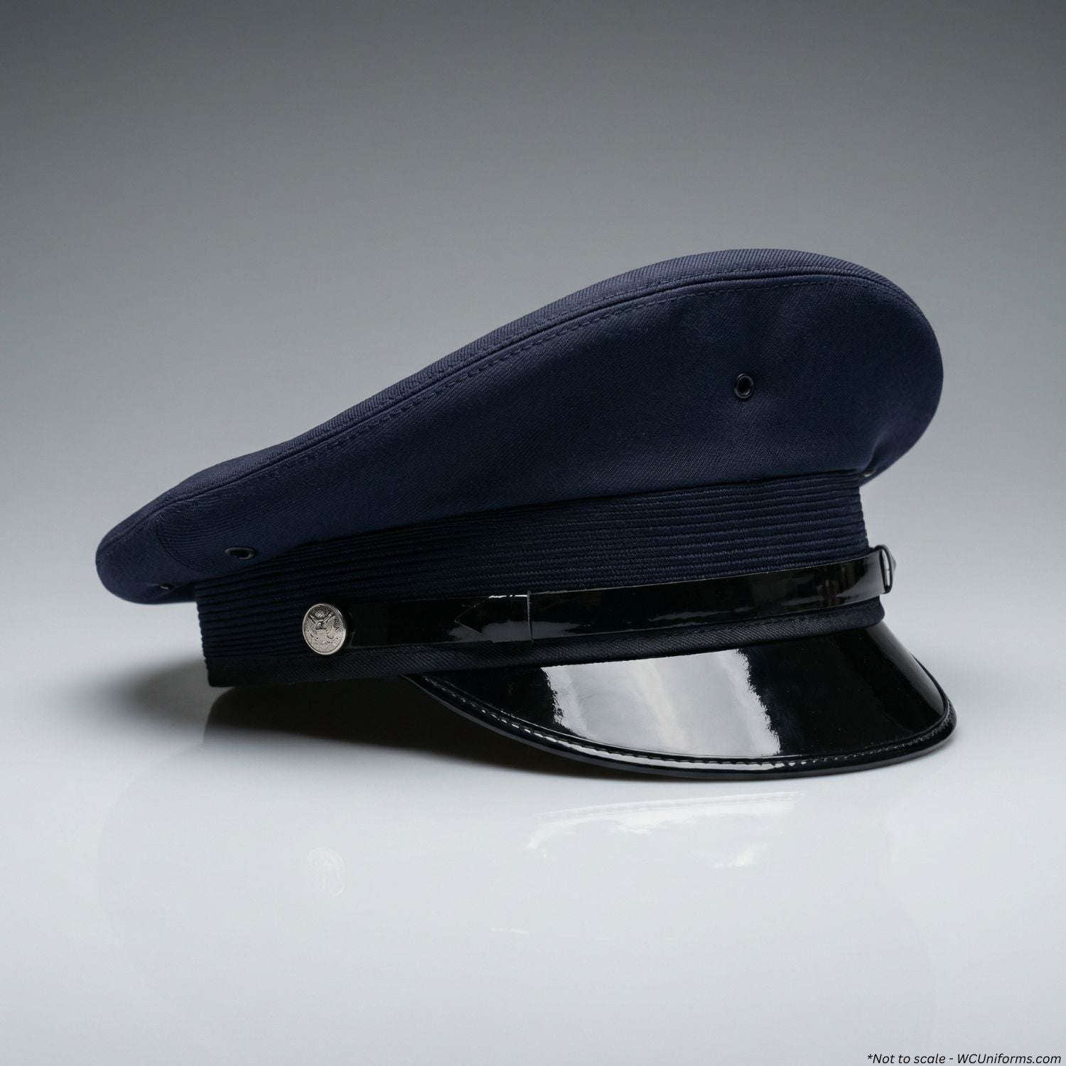 Navy blue police cap with a shiny band on a gray background