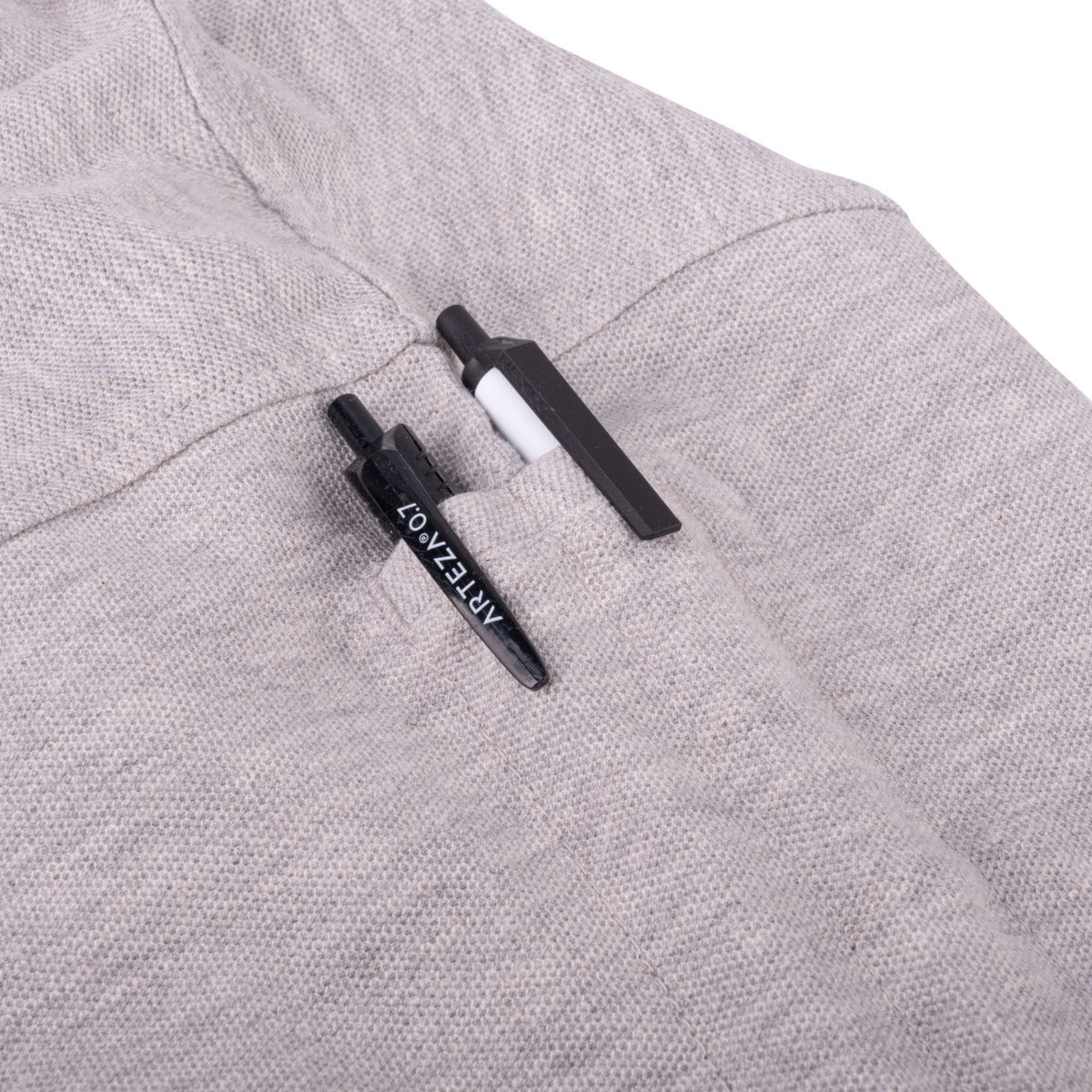Two sleeve pen pockets holding a pen on the First Class Tactical Security Polo