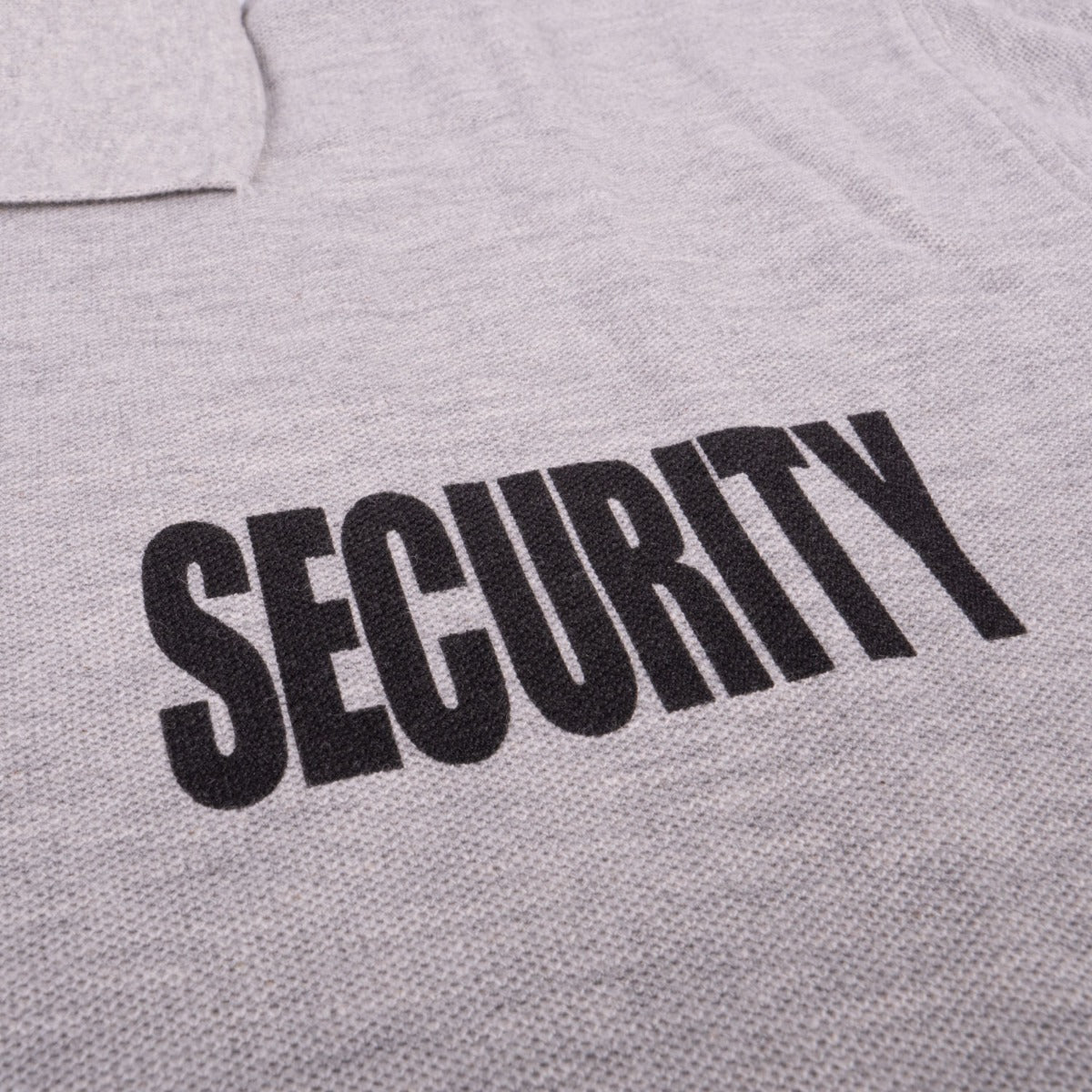 Silk-screened SECURITY lettering on the chest of the First Class Tactical Security Polo