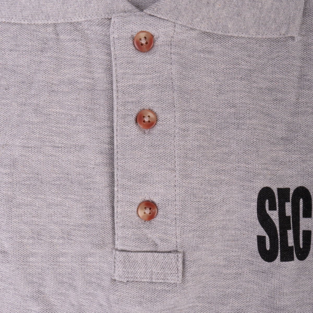 Three-button placket on the First Class Tactical Security Polo in heather gray
