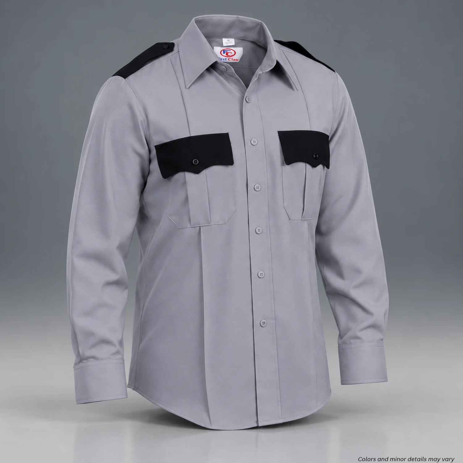 A light gray long-sleeve uniform shirt with black shoulder epaulets and black chest pocket flaps, shown on a neutral gray background.