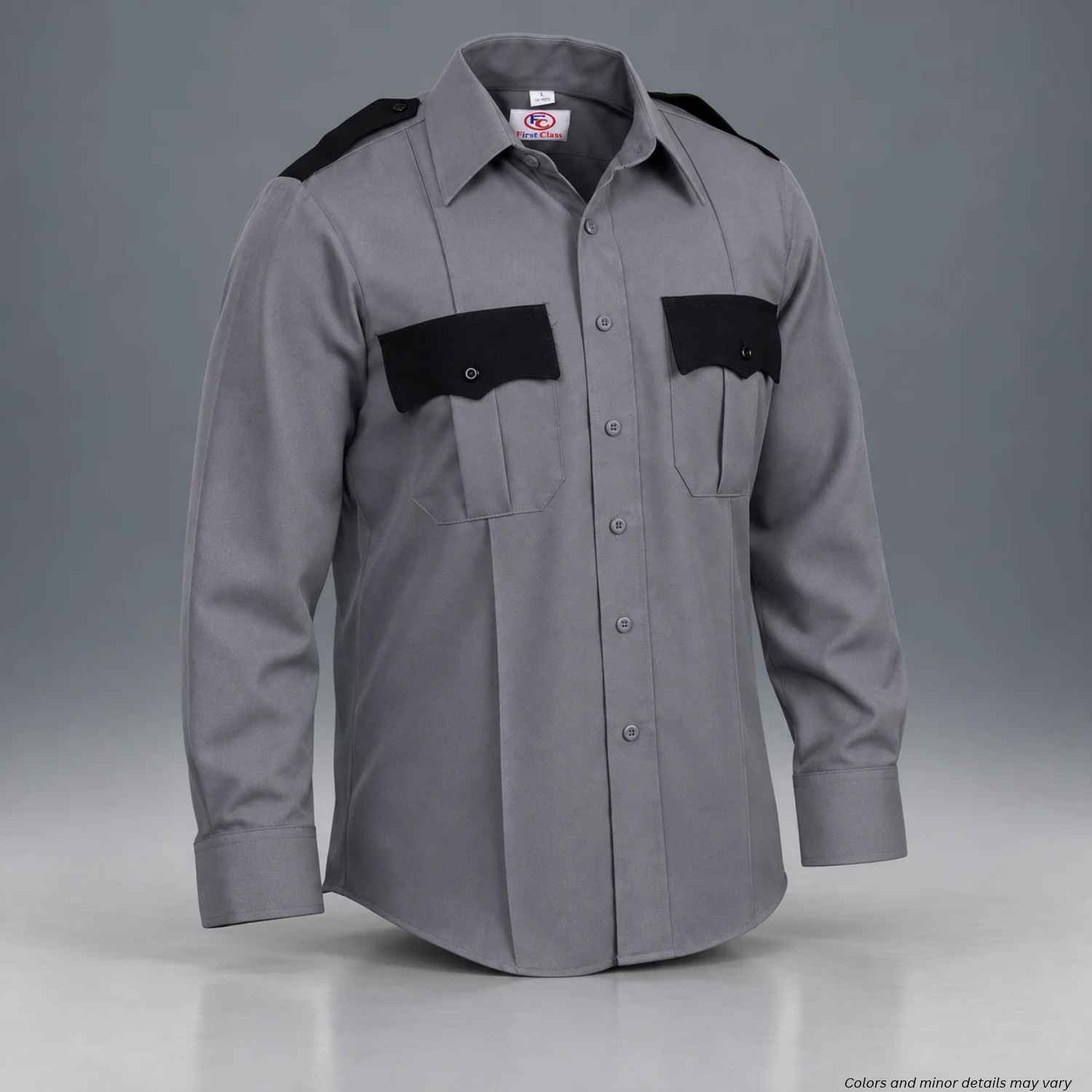 A gray long-sleeve uniform shirt with black shoulder and chest pocket panels, displayed on a mannequin against a gray studio background.