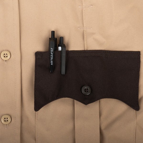 Close up pocket of a tan colored First Class Uniforms Two-Tone Short Sleeve Shirts