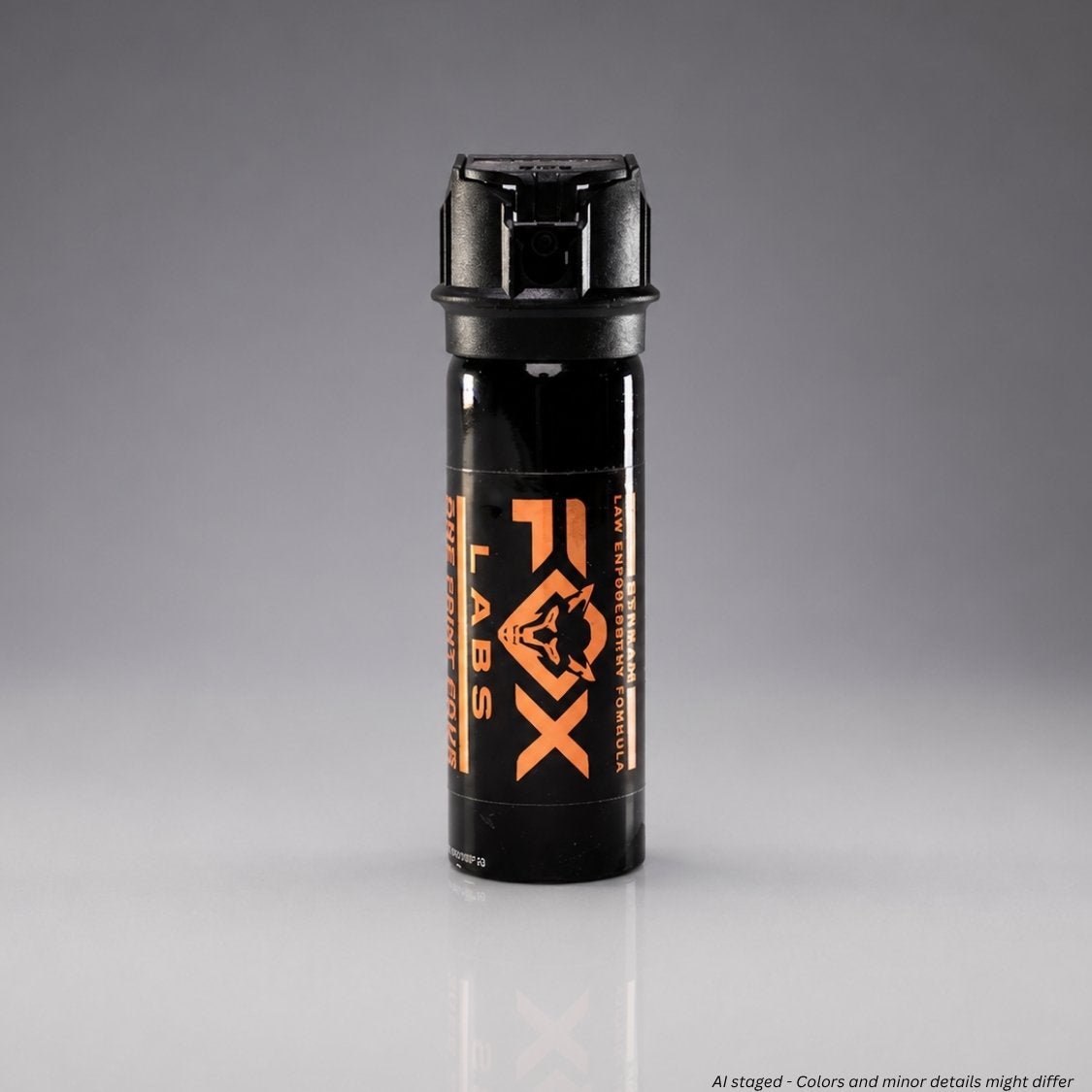 Black pepper spray canister with orange logo on a gray background