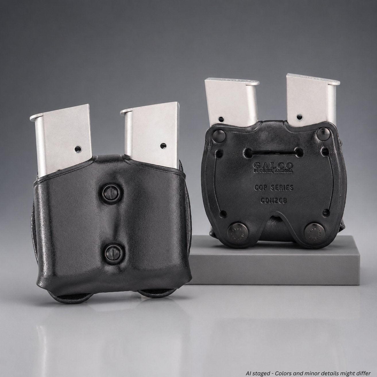 Two black gun magazine holders with silver magazines on a gray background