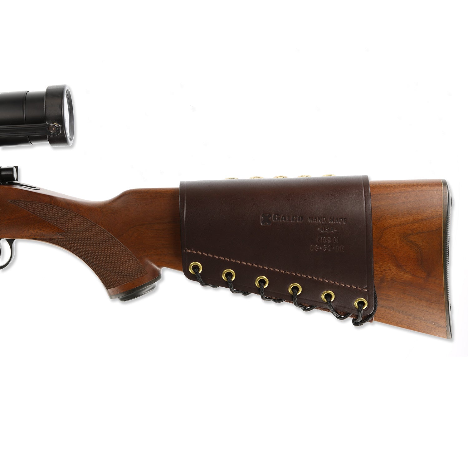 A brown leather rifle stock cover with brass grommets, shown fitted over the butt of a wooden-stocked rifle with a scope, on a white background.